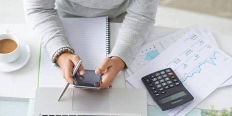 woman calculating on her phone